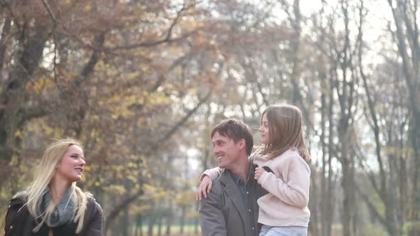 Young Family Having Fun Together In The Park 1