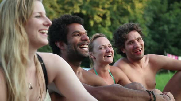 Four Friends Laughing While Sitting In Nature 4