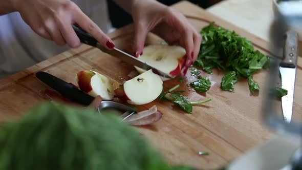 Close-Up Of Cutting Apple On Slices