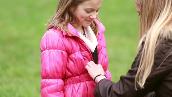 Mother Buttoning Daughter's Jacket