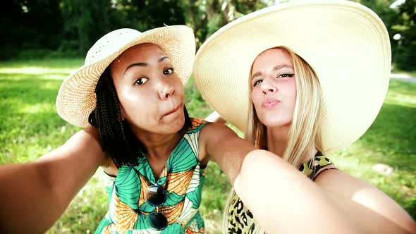 Two Young Women Having Fun While Taking A Selfie