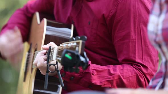 Close-Up Of Man Playing Guitar