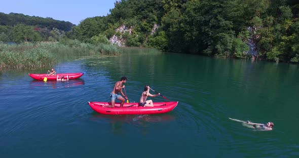 Friends Riding Canoe On River On Beautiful Sunny Day On Mreznica River, Croatia