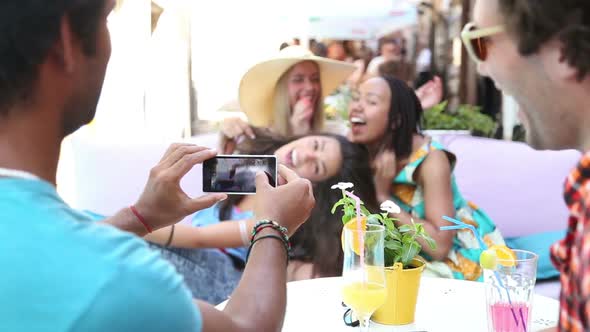 Young Man Taking Pictures Of Three Beautiful Women 2