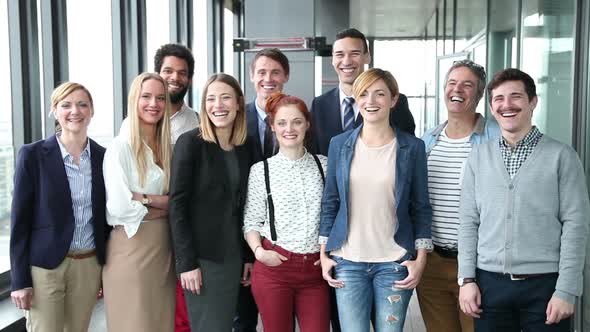 Portrait Of Business And Advertising Team, Looking At Camera And Laughing