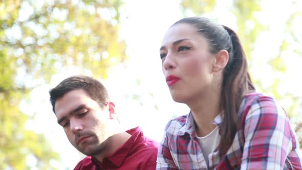 Close-Up Of Young Woman Singing And Man Playing Guitar 2