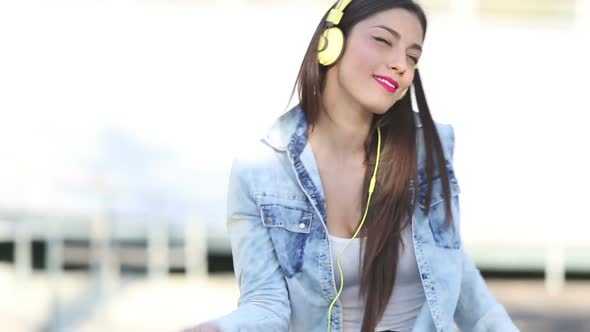Attractive Brunette Woman Listening To Music With Headphones 3
