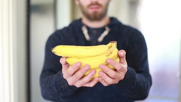 View Of Man Hands Holding Bananas