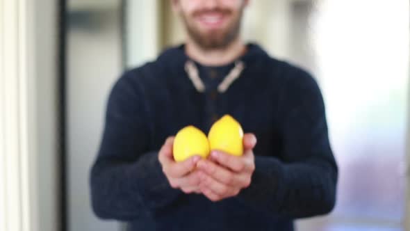 View Of Man Hands Holding Lemons