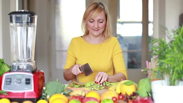 Girl Slicing Kiwi For Smoothie 2