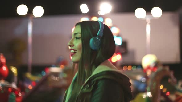 Attractive Girl Dancing To The Rhythm Of Music With Headphones 1