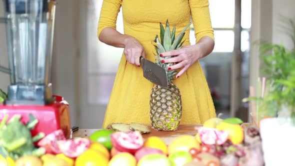 View Of Woman Hands Cutting Pineapple 1