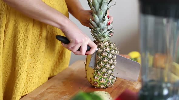 View Of Woman Hands Cutting Pineapple 4