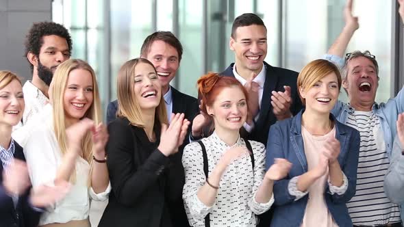 Portrait Of Happy Business People Clapping 1