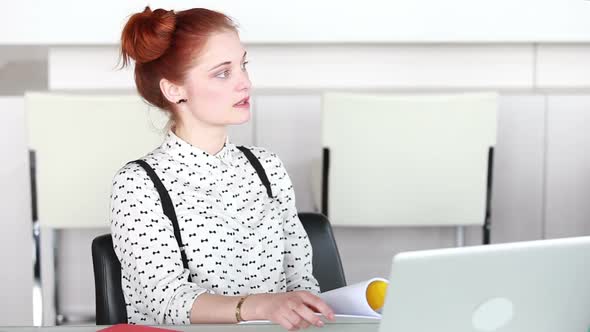 Attractive Woman Sitting At Conference Room, Listening To Presentation