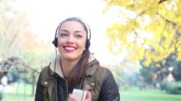Young Woman Listening To Music On Headphones And Dancing 2