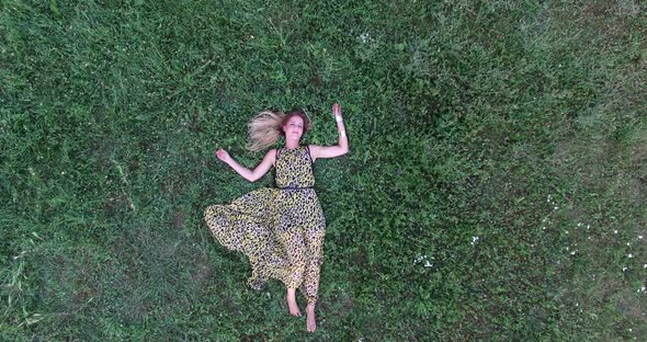 Young Woman Lying In Grass 1