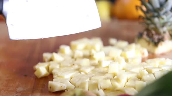 View Of Woman Hands Cutting Pineapple Into Pieces 5