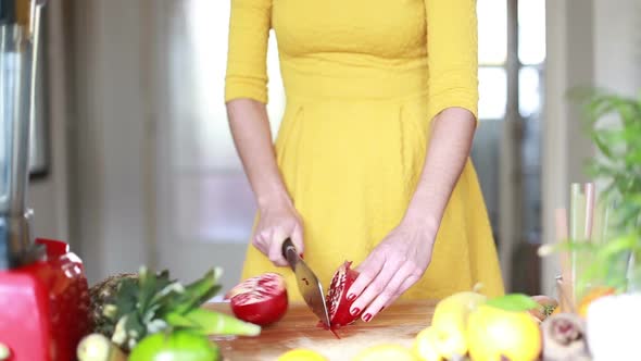 View Of Woman Hands Cutting Pomegranate 1
