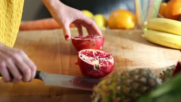 View Of Woman Hands Cutting Pomegranate 3