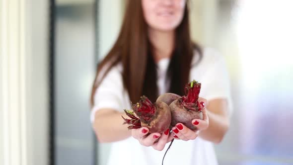 View Of Woman Hands Holding Beetroots