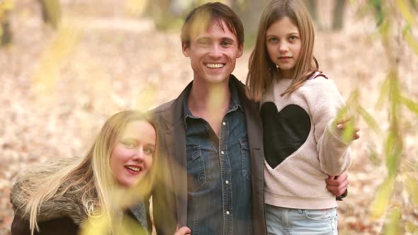 Portrait Of Young Family Looking And Smiling