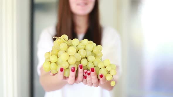 View Of Woman Hands Holding Bunch Of Grapes 1