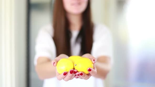 View Of Woman Hands Holding Lemons 1