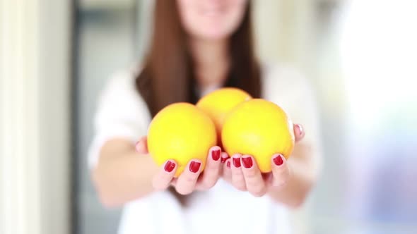 View Of Woman Hands Holding Lemons 2