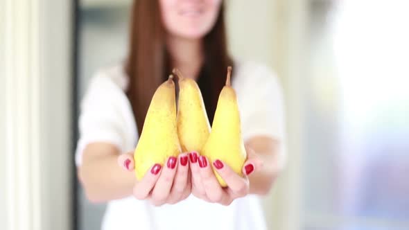 View Of Woman Hands Holding Pears