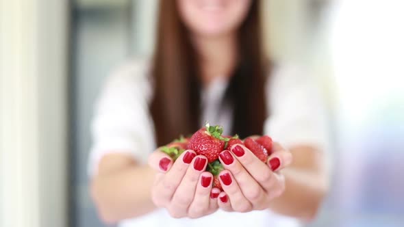 View Of Woman Hands Holding Strawberries