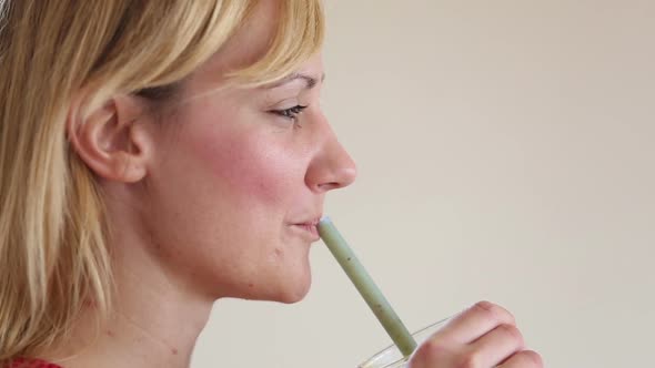 Profile Of A Woman Drinking Smoothie With A Straw 1