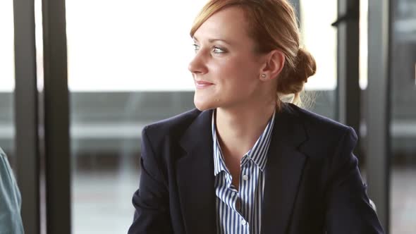 Beautiful Businesswoman Nodding And Smiling During Meeting In Conference Room