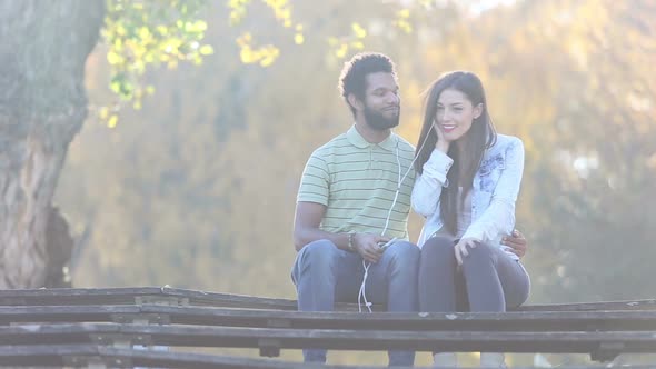 Couple Listening To Music Together, Sharing Earphones 3