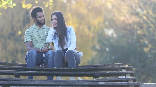 Couple Listening To Music Together, Sharing Earphones 6