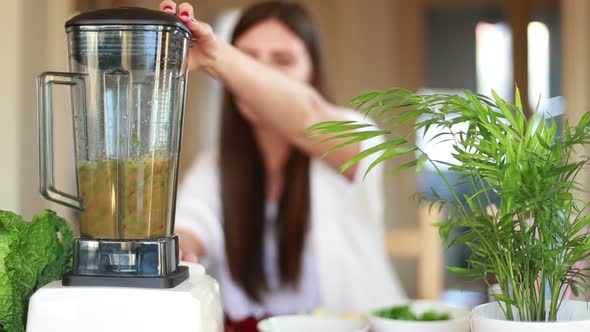 Woman Blending Vegetables