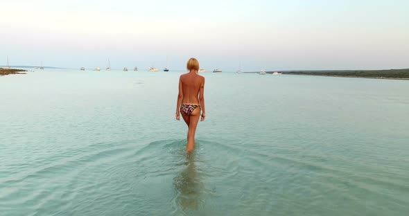 Woman Entering Into Sea At Slatinica Beach, Croatia 2