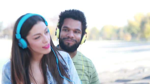 Couple With Headphones Listening To Music And Dancing To The Rhythm 3