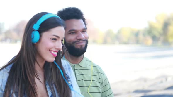 Couple With Headphones Listening To Music And Dancing To The Rhythm 4