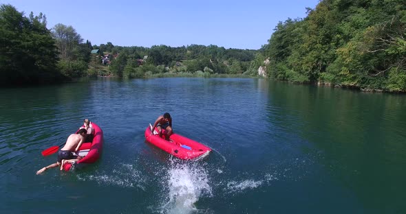 Woman Jumping From Canoe Into River