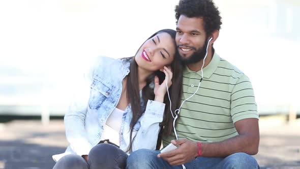Woman Leaning Head On Man's Shoulder While They Listening To Music 1