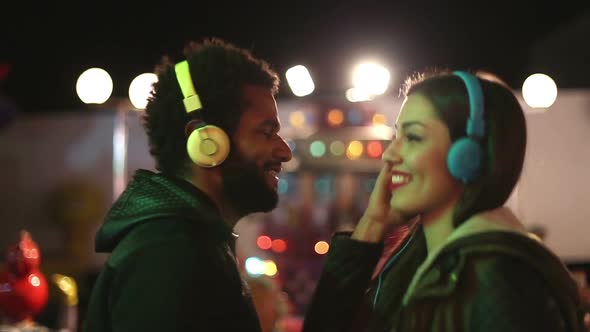 Man And Woman Dancing To The Rhythm Of Music With Headphones 5