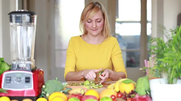 Woman Peeling Skin Off Kiwifruit 4