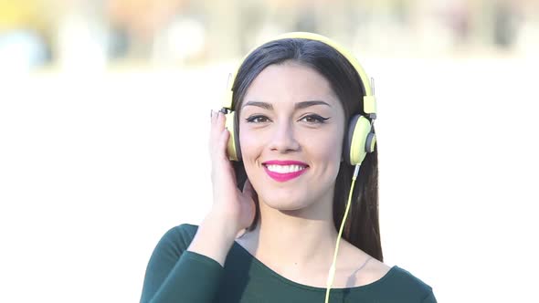 Beautiful Woman With Headphones Listening To Music 1