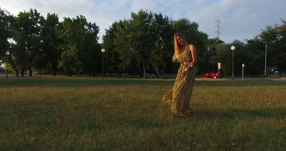 Beautiful Women Walking Barefoot In Grass At Sunset 1