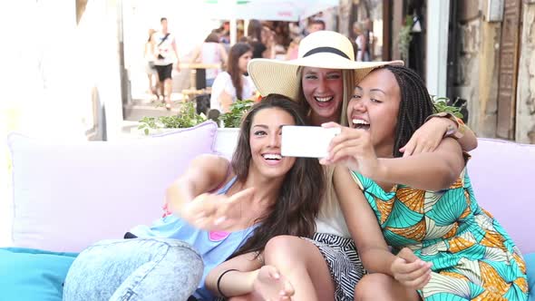 Beautiful Young Women Having Fun Taking Selfies In Town 4