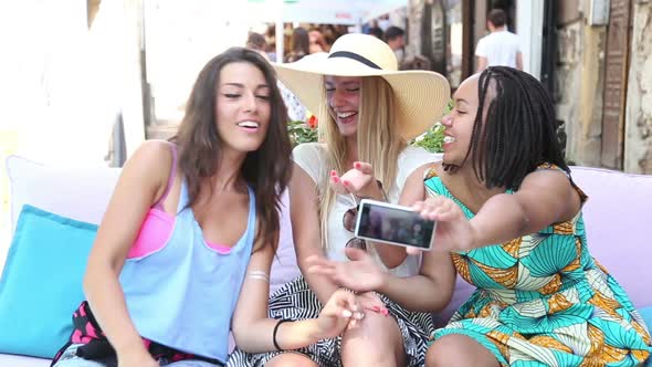 Beautiful Young Women Having Fun Taking Selfies In Town 9