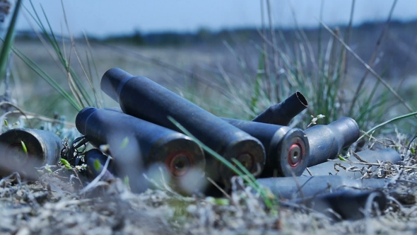 The Empty Machine Gun Shells In The Grass