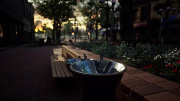 Closeup of a Drinking Water Fountain in a Park on Sunset