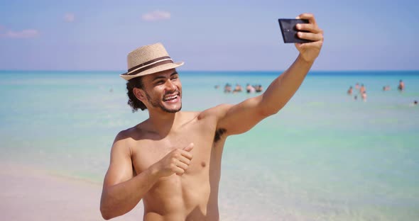 Man Gesturing Shaka and Taking Selfie